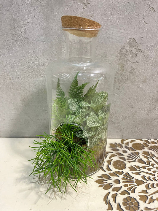 Zelený úkryt v láhvi